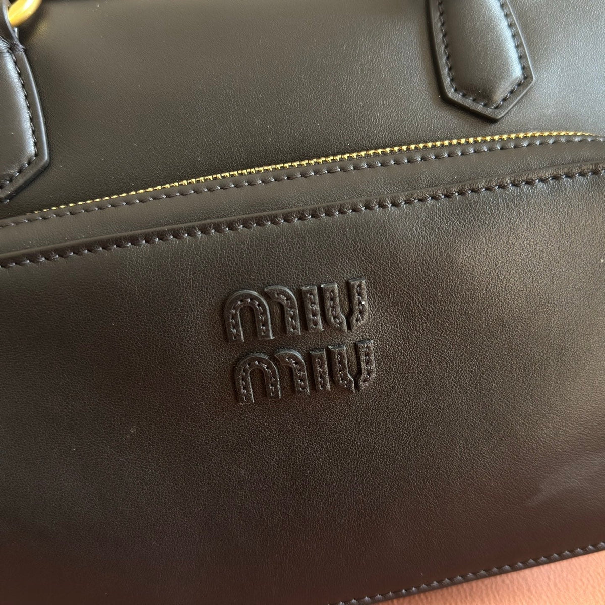 MIUMIU 26S POCKET TOP-HANDLE BAG 32 IN BLACK CALFSKIN GOLD HARDWARE