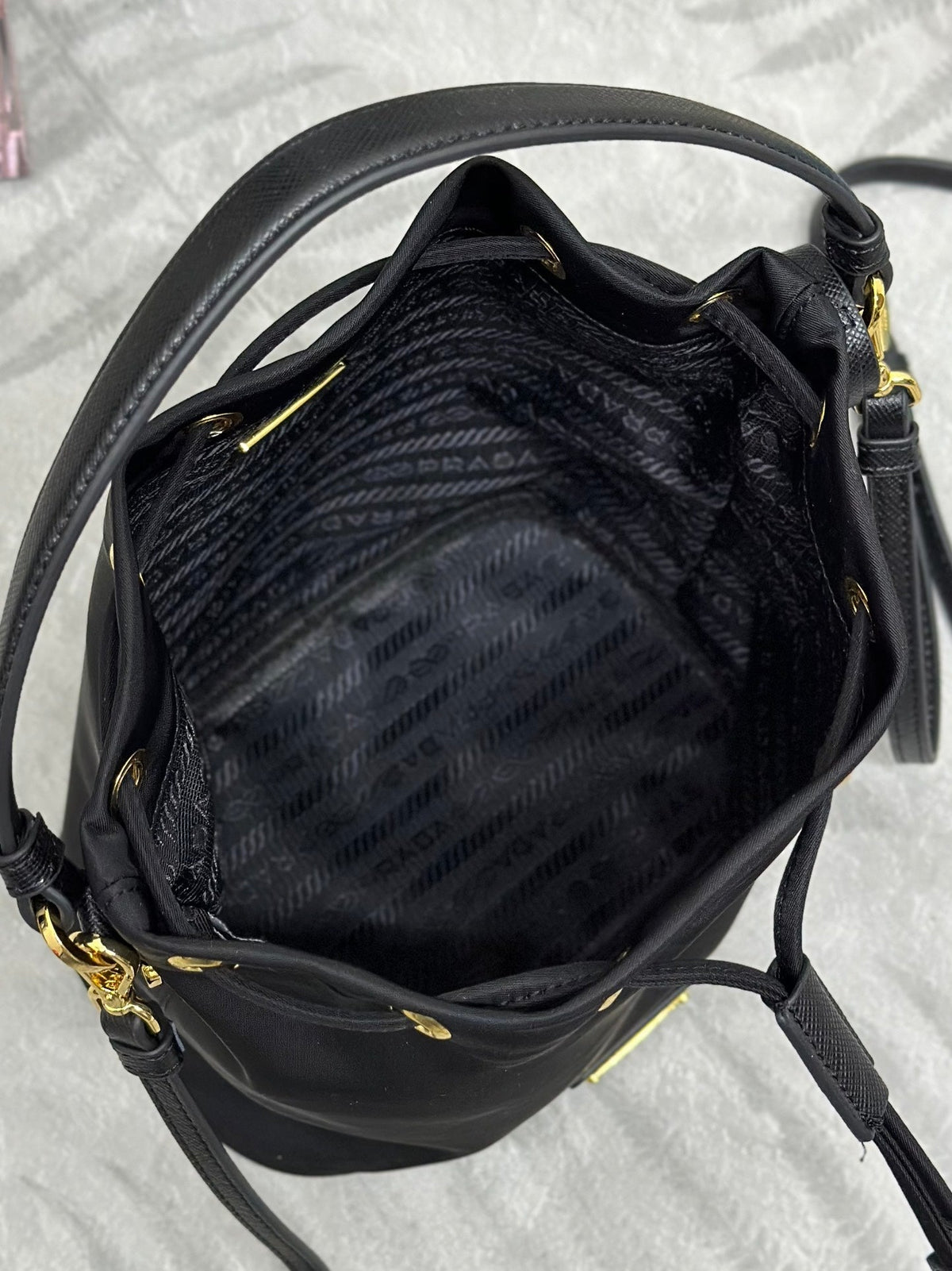 PRADA BUCKET BAG 19 IN BLACK RE-NYLON AND CALFSKIN HANDLE